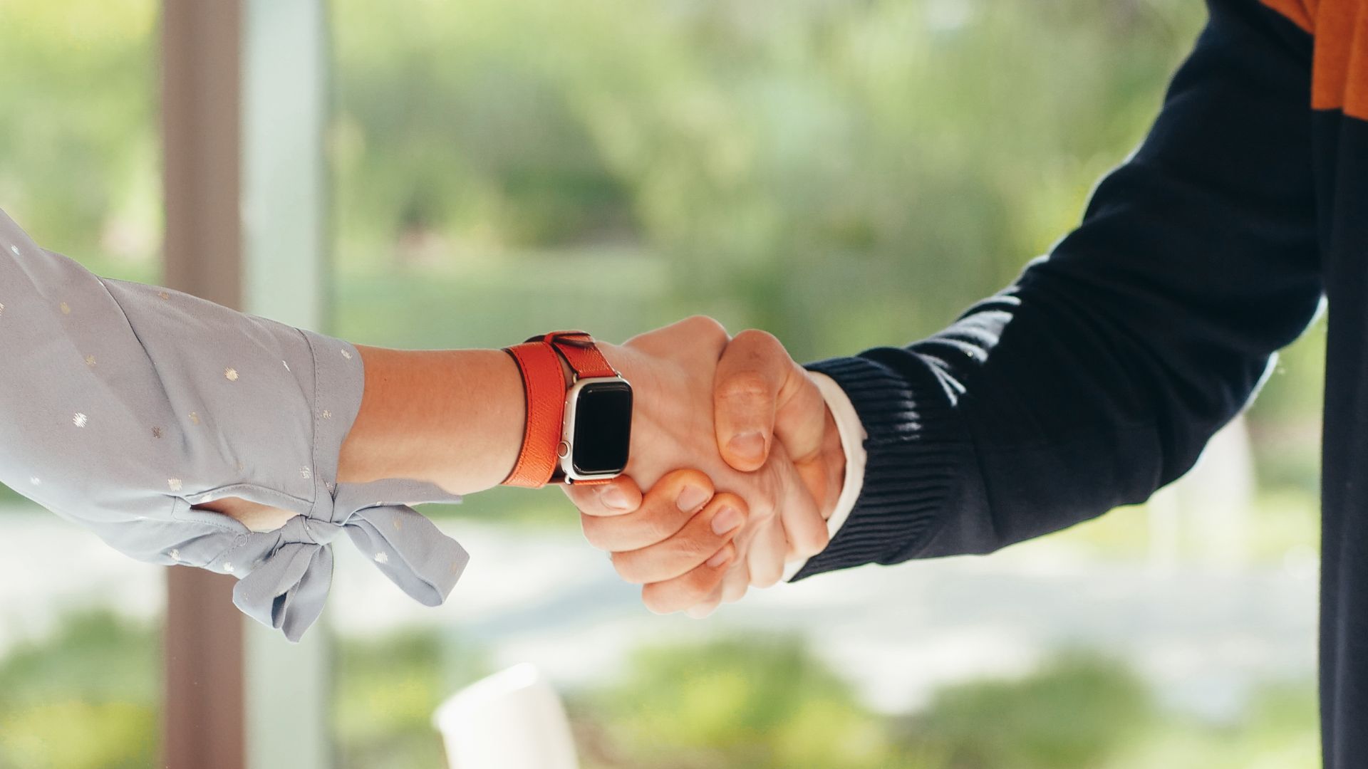 Business affiliates shaking hands.