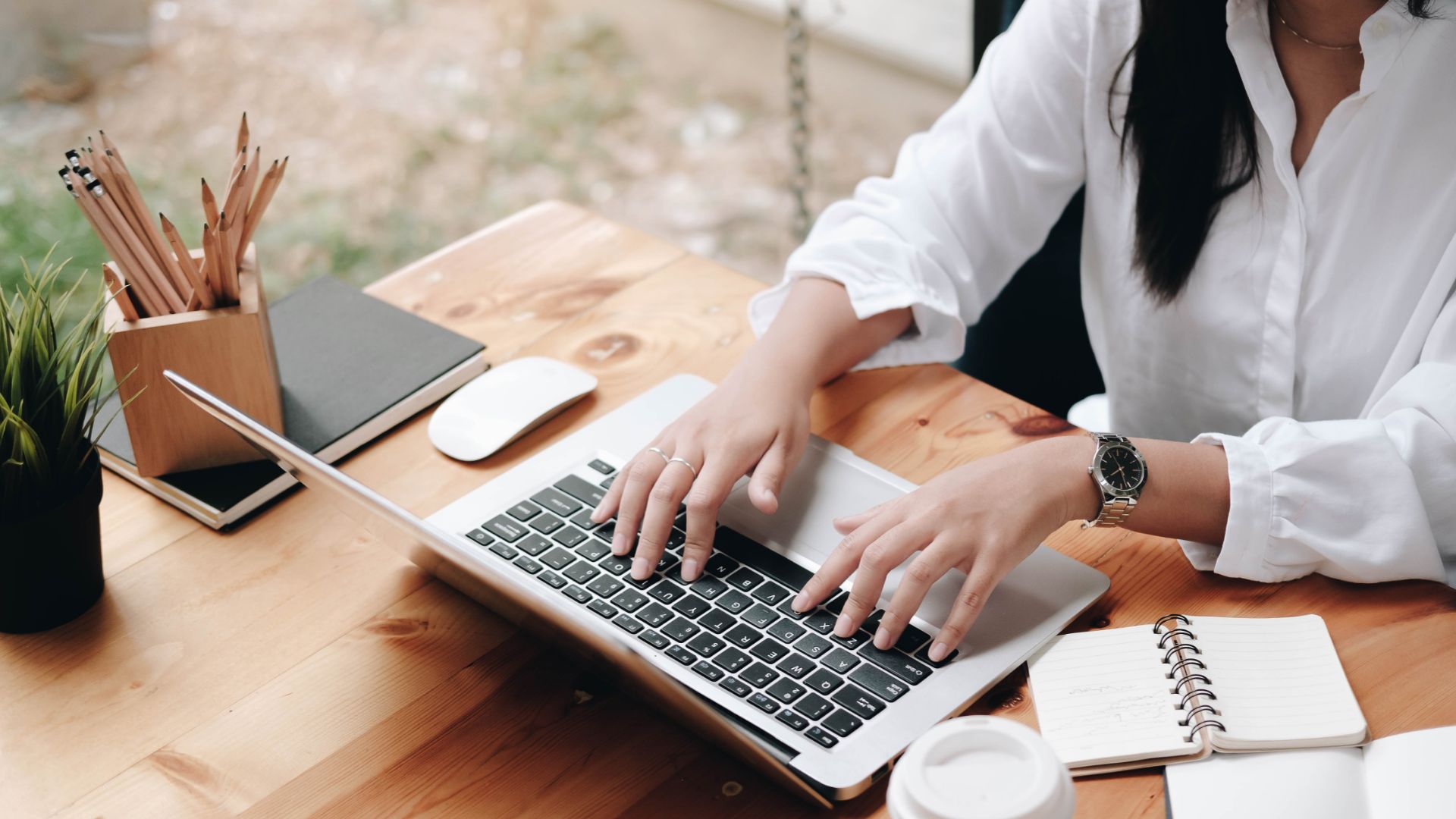 Woman working on laptop.